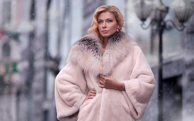A girl wearing a fur coat A girl wearing a fur coat